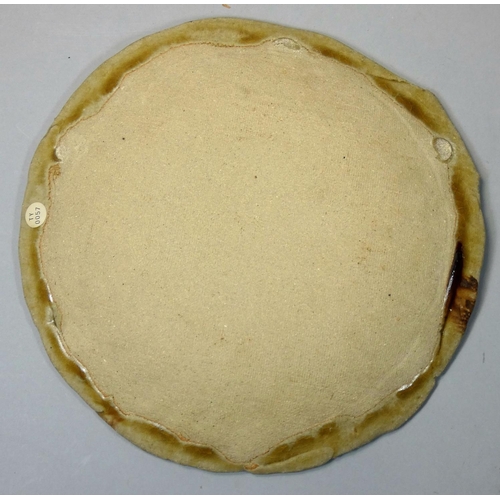133 - Takeshi Yasuda (b.1943), a brown glazed stoneware dish, label verso TY 0057, diameter 25 cm.