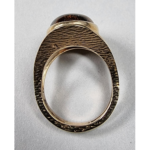 175 - A 9ct gold and goldstone dress ring, size N 1/2, 7.2 gms.