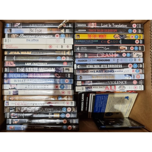 72 - A James Bond 'Golden Eye' theater poster together, with James Bond videos, a collection of DVDs, a P... 