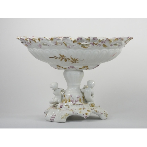111 - A 19th century continental pedestal dish, the lift off cover with two cherubs and fruit, similar ped... 