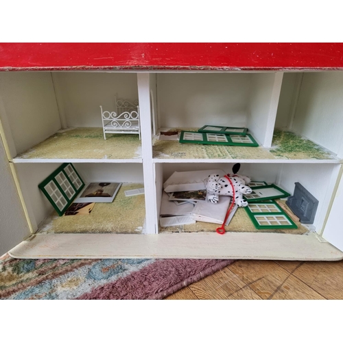 119 - A Carromco freestanding football table together, with a scratch built doll's house (2)