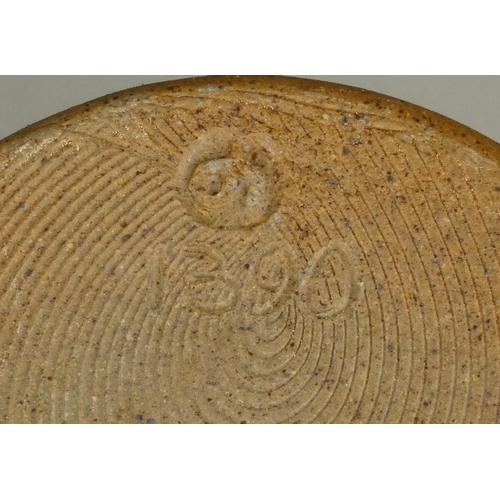 127 - An Unknown, a brown and beige mottled glazed stoneware flagon, height 26 cm, together with a small b... 