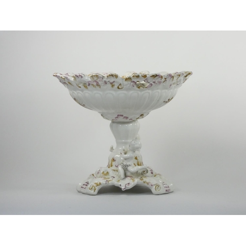 111 - A 19th century continental pedestal dish, the lift off cover with two cherubs and fruit, similar ped... 