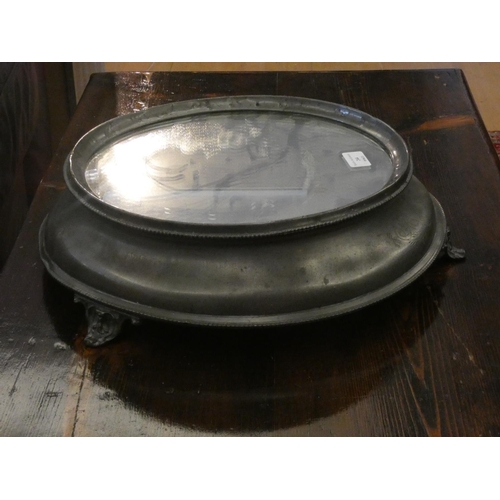 83 - A Victorian pewter cake stand with the original mirrored plate, beaded egg and dart borders framing ... 