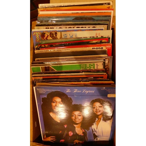 74 - A collection of Vinyl 33 RPM records including- BoneyM, ABBA, Elvis, Frank Sinatra and others.