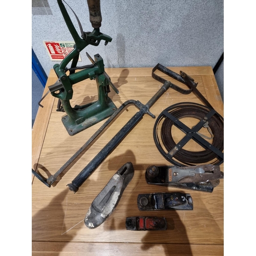 99 - A Bristol stirrup hand pump together with Stanley & Record planes and a German made cast iron bench ... 