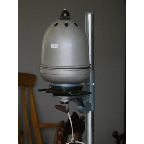 100 - A boxed Chinon 8mm projector, a Kodak Bakelite folding camera, free standing flash light and accesso... 