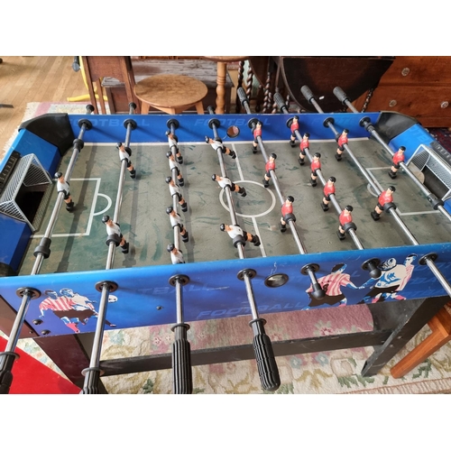 119 - A Carromco freestanding football table together, with a scratch built doll's house (2)
