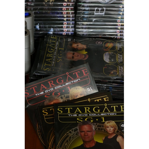 22 - A collection of Sci-Fi memorabilia including- including Star Trek, Stargate dvds and magazines (3)