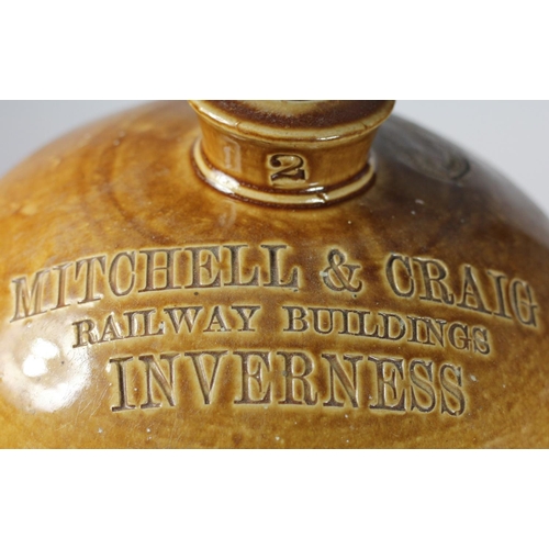 85 - A stoneware flagon marked 'Mitchell & Craig Railway Building, Inverness', height 36 cm, no handle