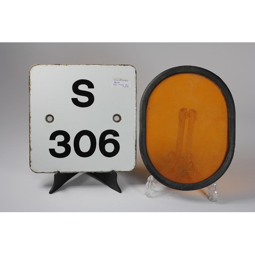 105 - A yellow and black distant signal blade, a signal arm orange aspect glass, and an enamel signal post... 