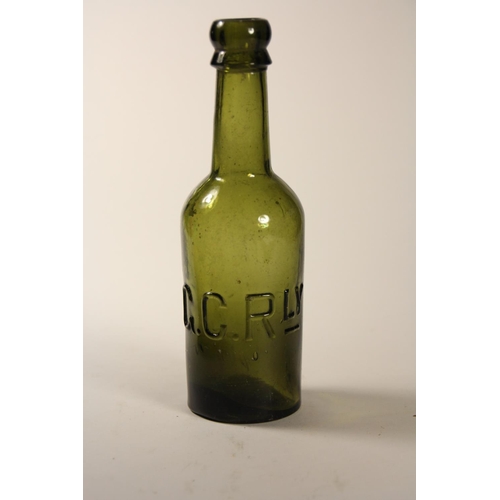 108 - Two 1/2 pint railway beer bottles, G.C.R green glass, LNER clear glass, both stamped with railway in... 