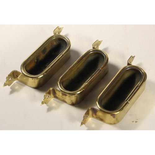 109 - Three carriage brass tip-up ashtrays, and a ACME Thunderdeer metal whistle stamped BR(M) (4)