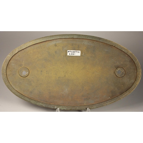 147 - A large oval brass replica work plate, 