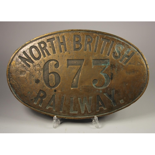 166 - A large oval brass cab side number plate, North British Railway 673 (replica) 28.5x45 cm