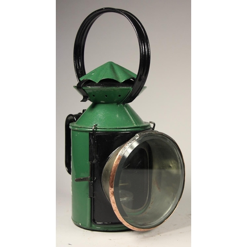 184 - A LNER green four aspect hand lamp, complete with burner and glasses