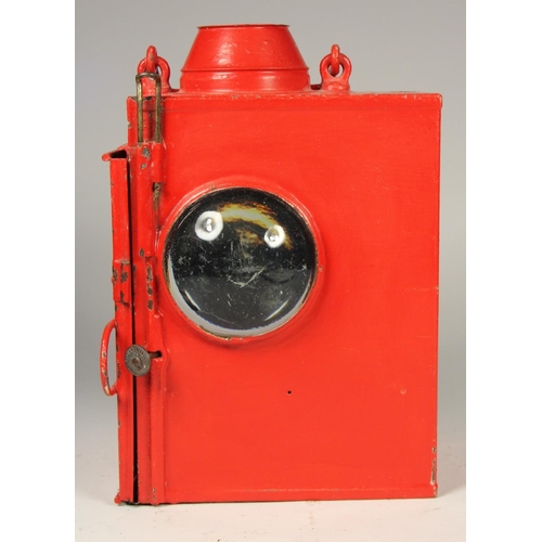 196 - A large red unmarked signal lamp, complete with burner