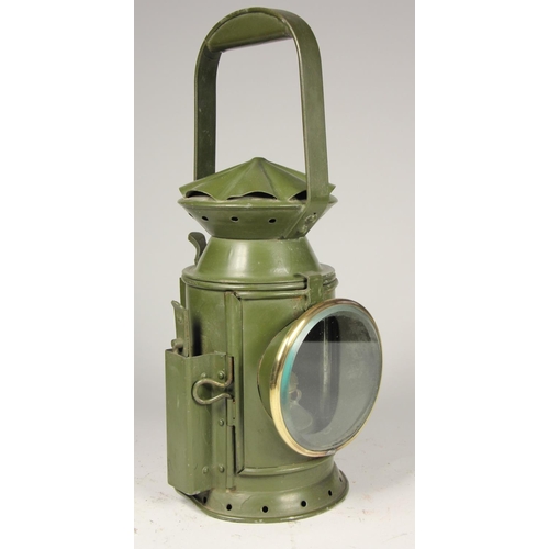 201 - A WD 1956 dark green 3 aspect hand lamp, body stamped with arrow and date, complete with burner