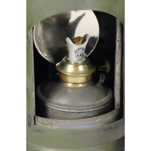 201 - A WD 1956 dark green 3 aspect hand lamp, body stamped with arrow and date, complete with burner