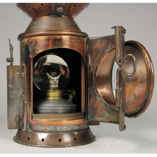 205 - A WD 1954 brass 3 aspect hand lamp, body stamped with arrow and date, complete with burner and glass... 