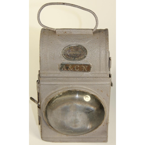 216 - A dark green 3 aspect no glasses WD 1944 handlamp, complete with burner, together with an American S... 