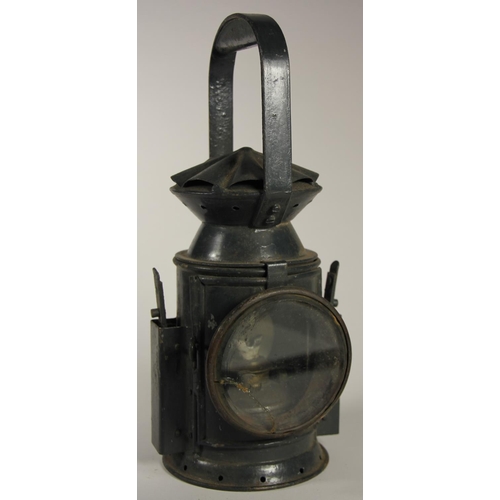 216 - A dark green 3 aspect no glasses WD 1944 handlamp, complete with burner, together with an American S... 