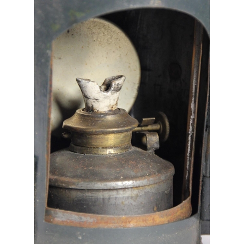 216 - A dark green 3 aspect no glasses WD 1944 handlamp, complete with burner, together with an American S... 