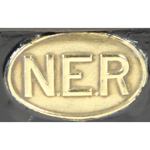 115 - A metal N.E.R leaflet rack with small brass N.E.R plaque, 33x27 cm