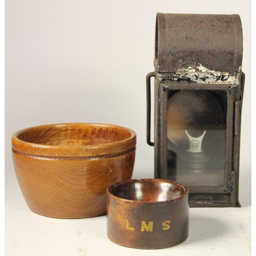 209 - A gauge lamp complete with L.N.E burner and two wooden bowls, largest bowl stamped with GER on base,... 