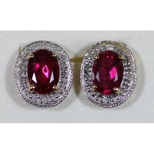 119 - A 9ct gold synthetic ruby and diamond pendant and a similar pair of ear studs