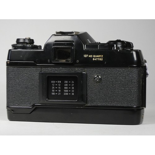 WITHDRAWN A Contax 137 md Quartz SLR 35mm camera, together with a