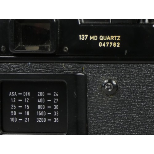 WITHDRAWN A Contax 137 md Quartz SLR 35mm camera, together with a
