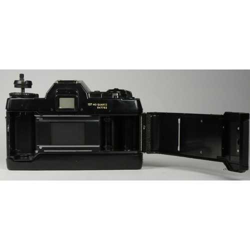 WITHDRAWN A Contax 137 md Quartz SLR 35mm camera, together with a