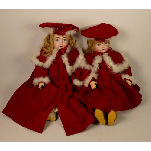 290 - A pair of twins composite dolls, with sleepy eyes and composite bodies, together with a red Christma... 