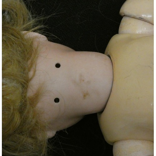 290 - A pair of twins composite dolls, with sleepy eyes and composite bodies, together with a red Christma... 