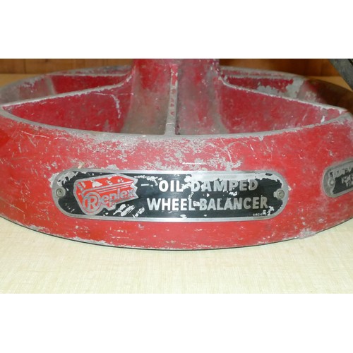 85 - An Repco oil damped wheel balancer with manual