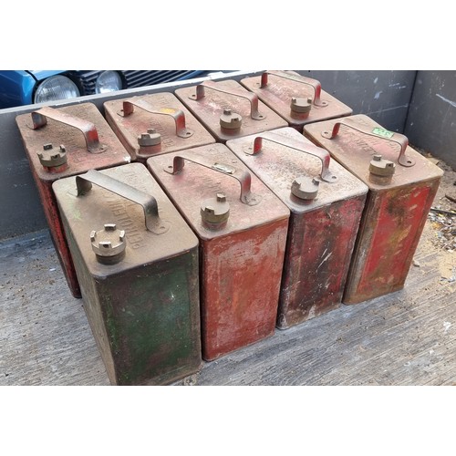 80 - Eight two gallon petrol cans with brass caps