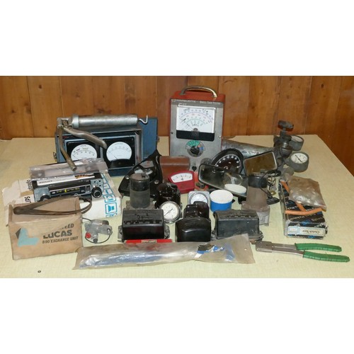 162 - A collection of vehicle gauges, dials, meters and tools, including a Phillips Autoradio