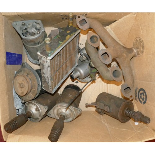 163 - A collection of starter motors, alternators, radiators and manifolds