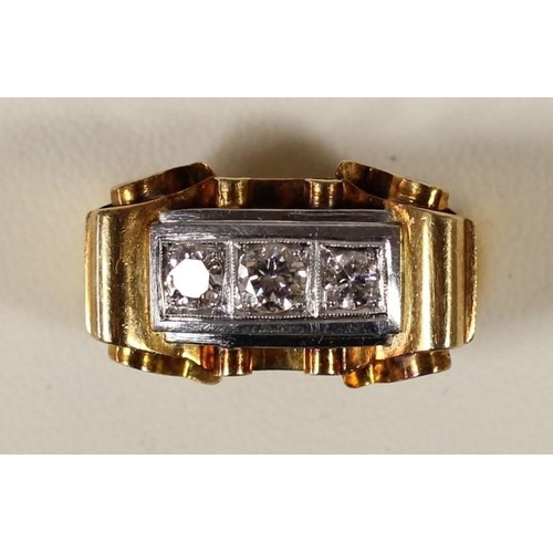 66 - An 18K gold three stone diamond Odeonesque cocktail ring, set with brilliant cut stones, approximate... 
