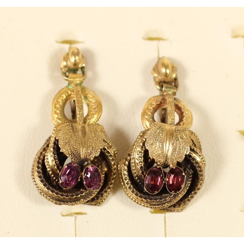 72 - A Victorian pair of gold and garnet floral scroll ear rings, later screw fittings, 30mm, 3.8gm