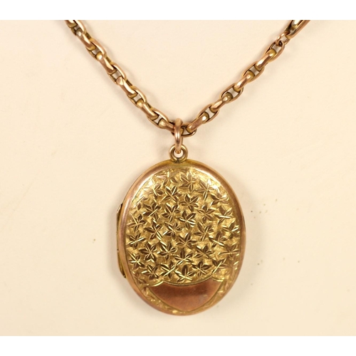 75 - An Edwardian 9ct rose gold oval locket/pendant, Chester 1907, with engraved floral decoration 32 x 2... 