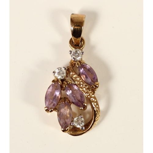 76 - An 18K gold amethyst and diamond scroll pendant, claw set with brilliant and navette cut stones, 25m... 