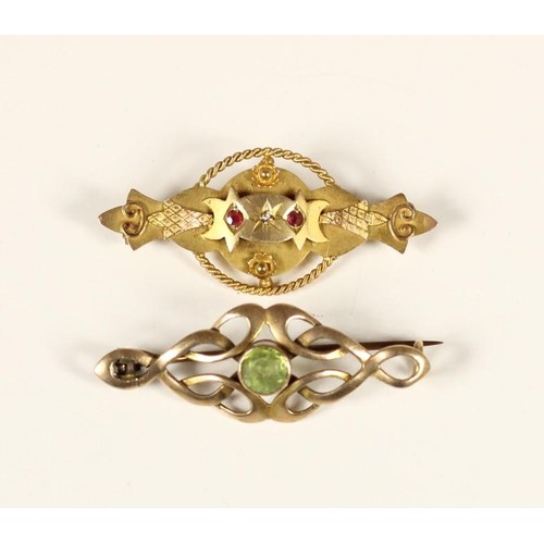 80 - An Art Nouveau rose gold and peridot scroll brooch, unmarked and a Victorian 9ct gold red paste and ... 