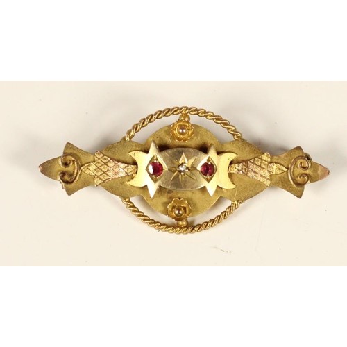 80 - An Art Nouveau rose gold and peridot scroll brooch, unmarked and a Victorian 9ct gold red paste and ... 