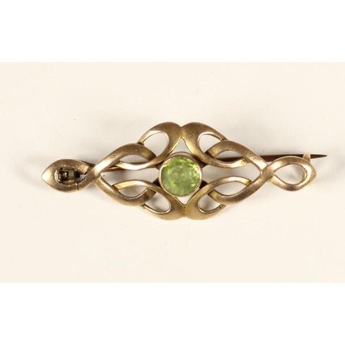 80 - An Art Nouveau rose gold and peridot scroll brooch, unmarked and a Victorian 9ct gold red paste and ... 