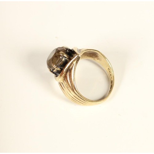 86 - A 9ct gold and smokey quartz dress ring, L, 5.1gm