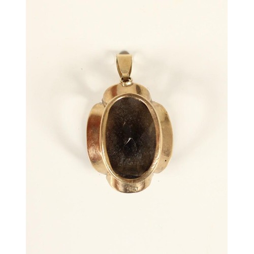 87 - A gold mounted smokey quart pendant, unmarked, stone 20 x 15mm, 5.7gm