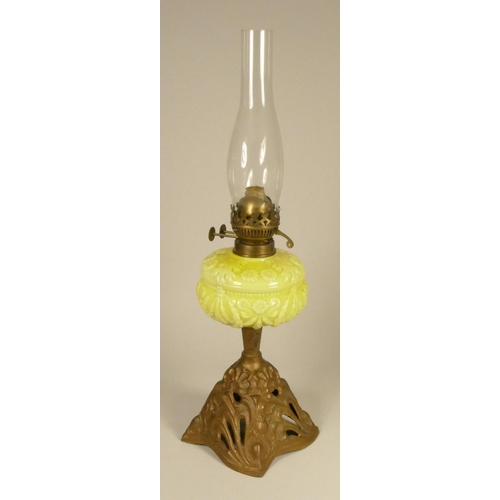 166 - A 19th century cranberry glass oil lamp, on a gilt metal base, 52 cm, together with a vaseline glass... 