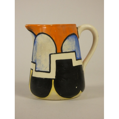 175 - Clarice Cliff, Bizarre, a geometric tankard cream jug, c.1929, hand painted in orange, black and blu... 